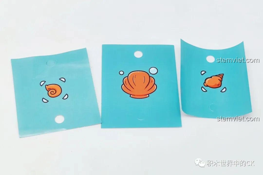 Các mảnh ghép in hình vỏ sò, ốc biển của bộ đồ chơi Sách kỳ ảo KY7069, chi tiết sắc nét, màu sắc tươi sáng.