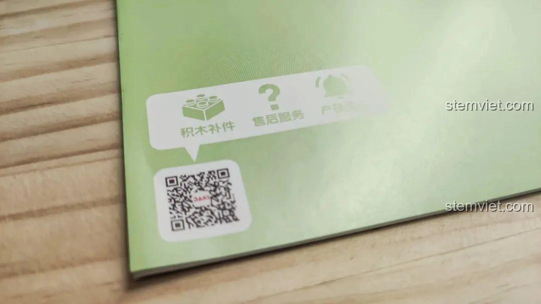 Mặt sau sách hướng dẫn của bộ lắp ghép Khủng long Bạo Chúa Ăn Vặt JAKI JK5102, có mã QR hỗ trợ.