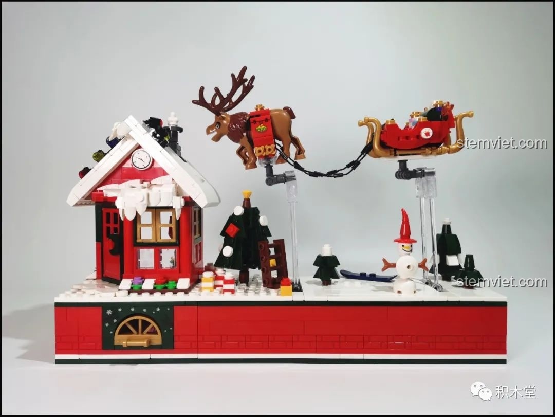 Mô hình hoàn chỉnh của bộ lắp ráp Forange FC6003, với ngôi nhà, xe trượt tuyết và tuần lộc bay.