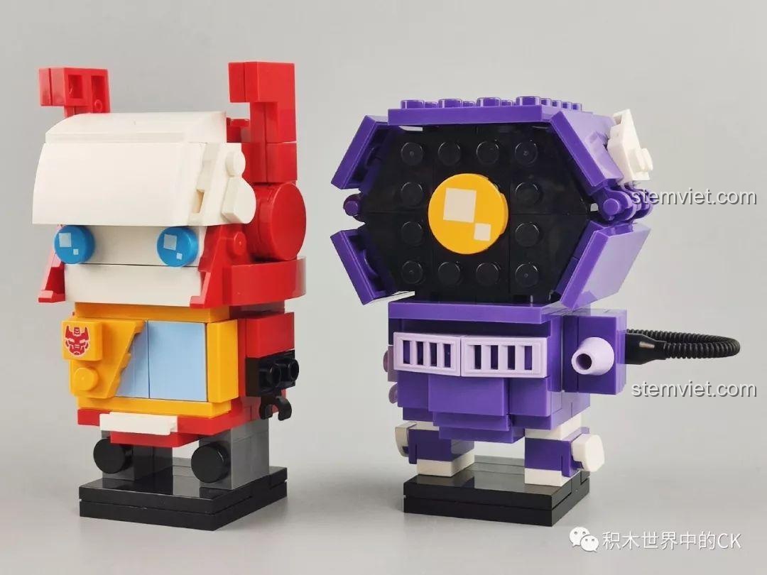 Mô hình lắp ráp hoàn chỉnh của Recording Warrior và Shockwave từ series JiSi Cute Doll, với màu đỏ và tím đặc trưng.