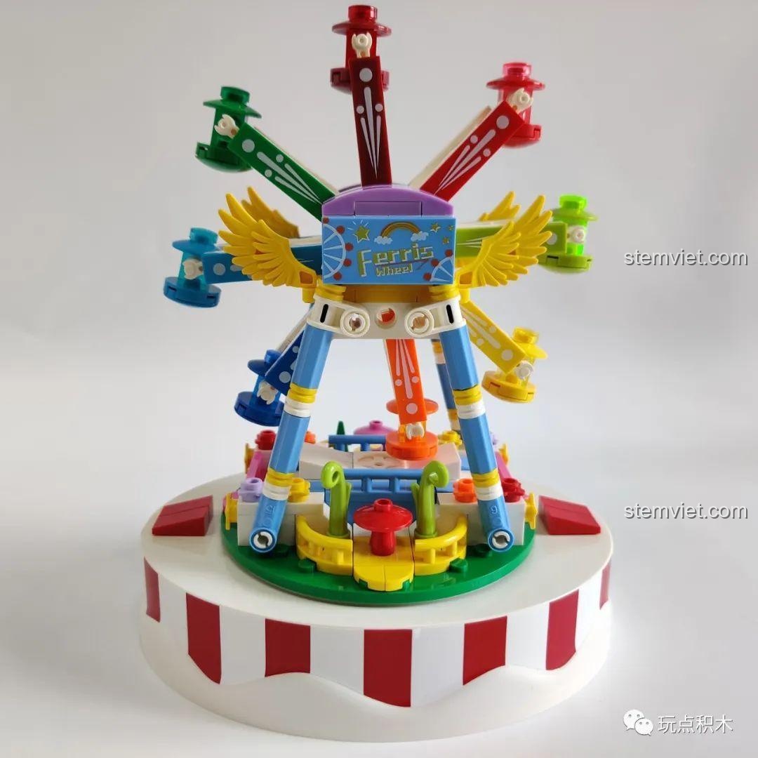 Mô hình Hộp Nhạc Vòng Quay Hạnh Phúc WOMA C0366 hoàn thiện, với vòng quay nhiều màu và các cabin nhỏ.