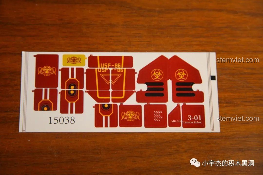 Tờ sticker chi tiết với các biểu tượng và số hiệu dành cho bộ lắp ráp Mould King 15038 Robot Crimson.