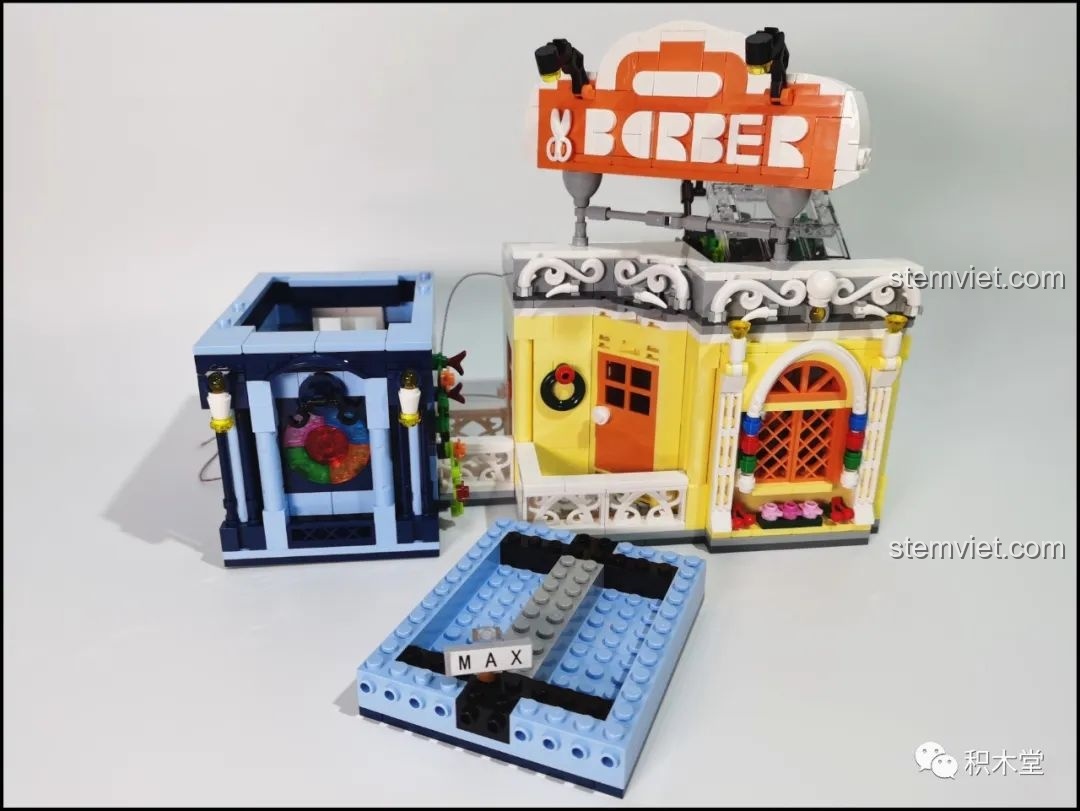Hiệu ứng ánh sáng rực rỡ của bộ Mould King 16031 Tiệm Cắt Tóc Phố Nhỏ với đèn LED đổi màu, tạo cảm giác sống động.