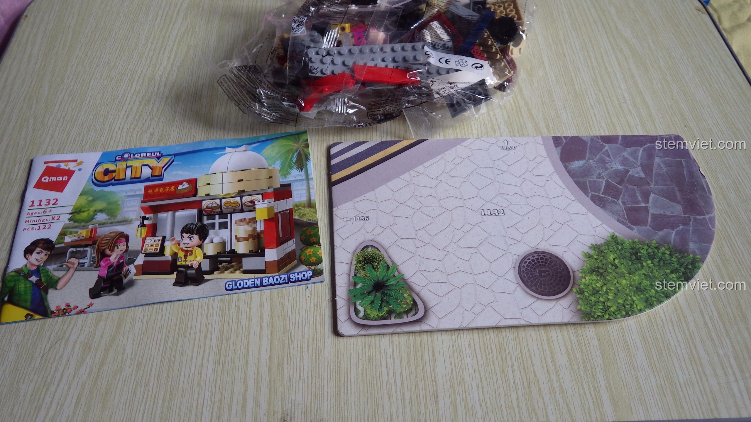 Mặt sau hộp bộ xếp hình QMAN 1132, giới thiệu các bộ khác trong series Colorful City.