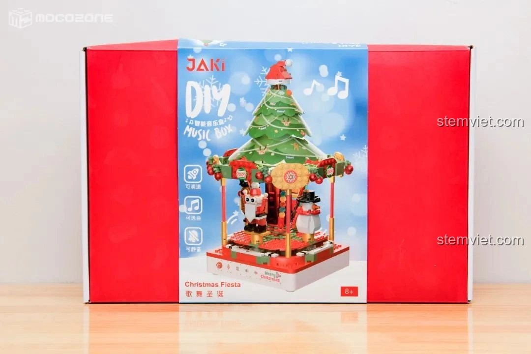 Hộp đồ chơi Hộp nhạc Giáng Sinh Xoay Tự Động JAKI JK1365 màu đỏ nổi bật, hình ảnh mô hình hoàn chỉnh, biểu tượng tính năng xoay, phát nhạc, phát sáng.