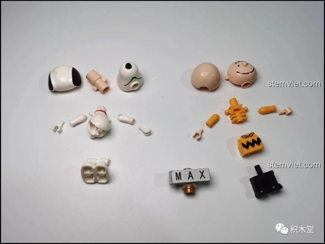 Các mảnh ghép rời của nhân vật Snoopy, Charlie Brown và Lucy trong bộ LiNooS LN8006, sẵn sàng để lắp ráp thành minifigures.
