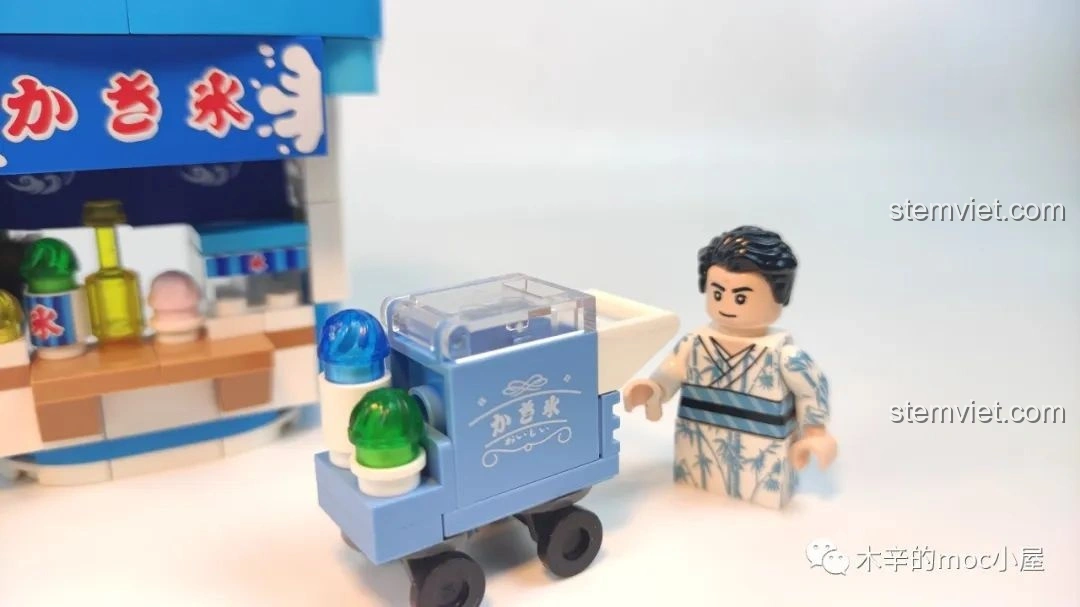 Cận cảnh minifigure và chiếc xe đẩy kem nhỏ xinh của bộ Tiệm kem đá bào Wekki 506041, chi tiết tỉ mỉ.