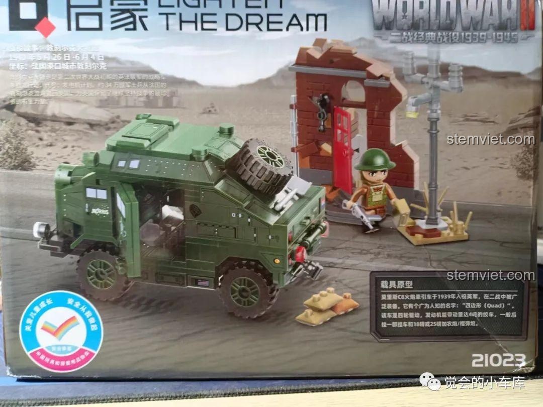 Mặt trước hộp bộ lắp ráp QMAN 21023 Xe Kéo Pháo Morris C8, thể hiện mô hình xe và cảnh quan chiến trường.