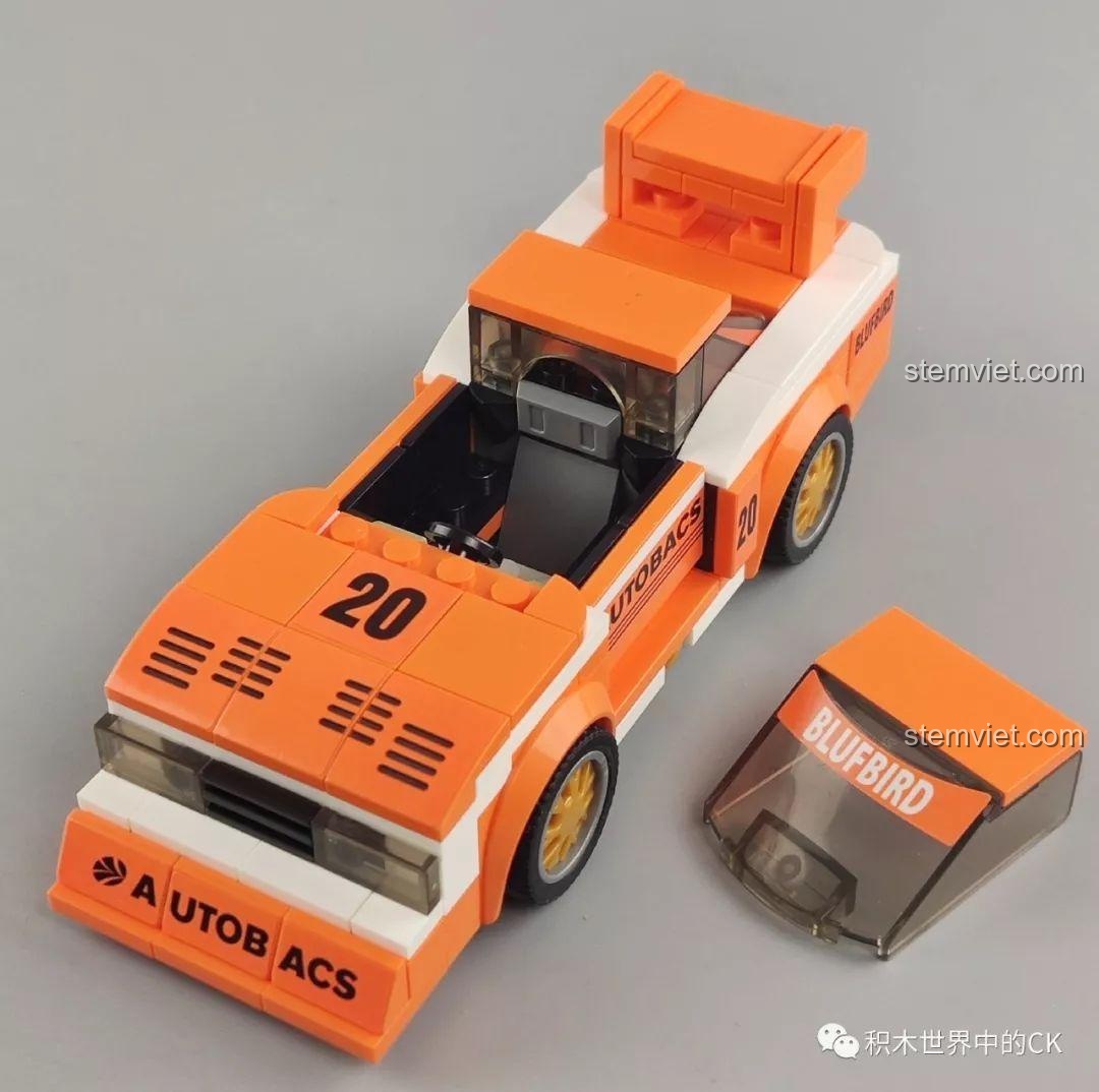 Mô hình xe đua Nissan KY910 Bluebird Super Silhouette 607061 màu cam với minifigure tay đua bên trong.