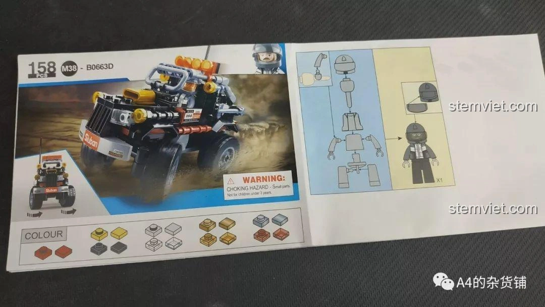Khung gầm của xe địa hình Sluban M38-B0663D Explorer đang trong quá trình lắp ráp, với các chi tiết như bình xăng giả và bậc lên xuống, tạo sự chân thực.