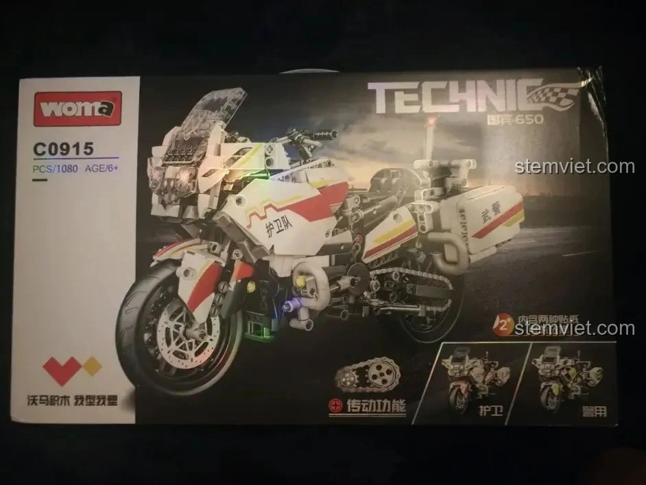 Hộp đồ chơi lắp ráp WOMA C0915 Mô tô Quốc宾-650 với hình ảnh xe cảnh sát màu trắng đỏ, mã sản phẩm và số chi tiết.