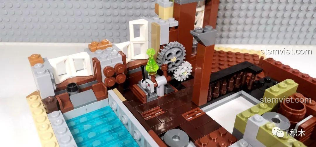 Một góc khác của nội thất tầng 2 bộ Tòa Nhà Góc Phố Đa Năng Zhe Gao QL0919, với giường và bàn làm việc.