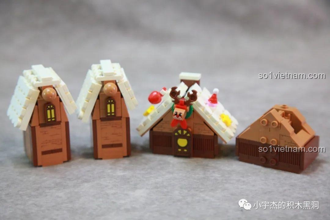 Các ngôi nhà bánh gừng đã được đặt lên đế xoay của bộ Cây Thông Giáng Sinh Nhạc Hội SEMBO 605025, tạo thành một khu vườn nhỏ.