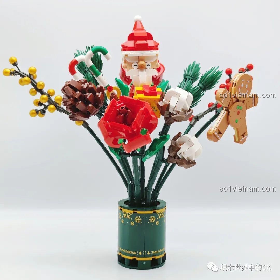 Bó hoa lắp ráp SEMBO 605026 gần hoàn thành, với hoa hồng đỏ và bông tuyết được thêm vào.