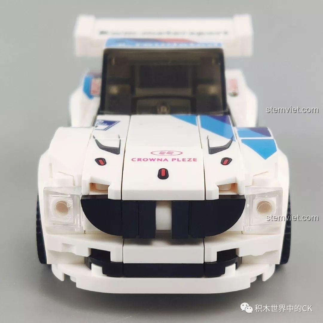 Góc nhìn từ trên xuống của mô hình xe đua BMW Z4 màu trắng Sembo 607051, với các chi tiết decal trên mui xe.