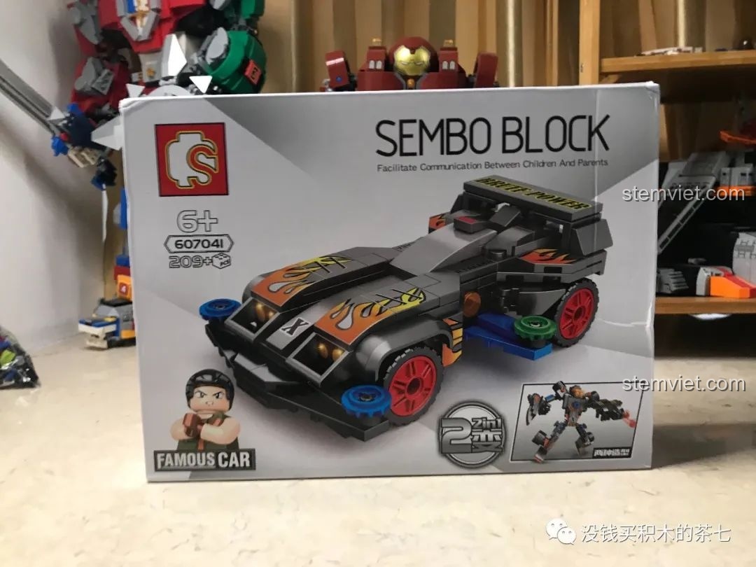 Thân xe Brute Power đang được lắp ráp, với các mảnh ghép màu đen, cam và decal lửa.