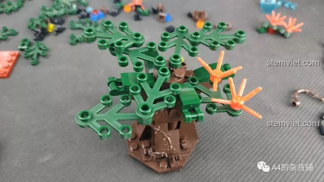 Lắp ráp các cành lá xanh cho mô hình cây trong bộ SEMBO 107016 Cây Lưu Lạc Địa Cầu.