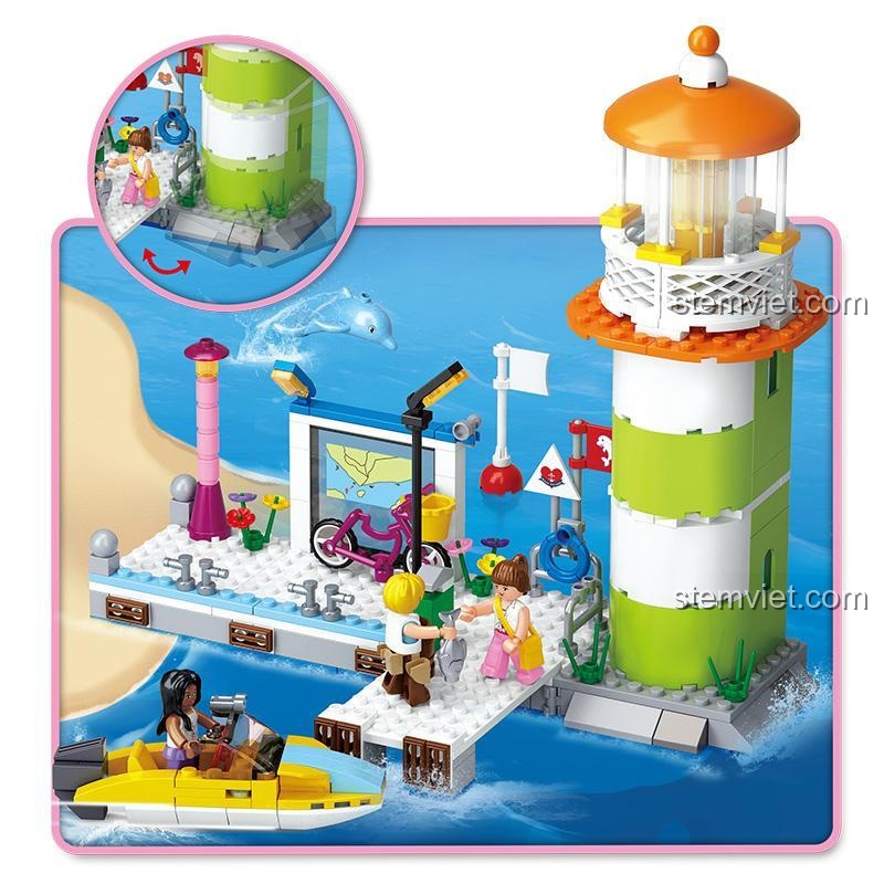 Cận cảnh bến tàu Vịnh Cá Heo Mơ Ước Hồng với đèn LED sáng rực, cá heo bơi lội và thuyền kéo lùi, mang đến trải nghiệm đồ chơi lắp ghép sống động cho bé gái 6 tuổi.