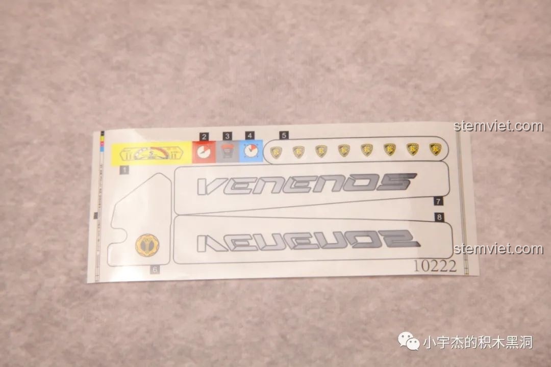 Tờ sticker cho phiên bản tiêu chuẩn của K-box 10222, với logo Venenos và các chi tiết trang trí tinh tế.