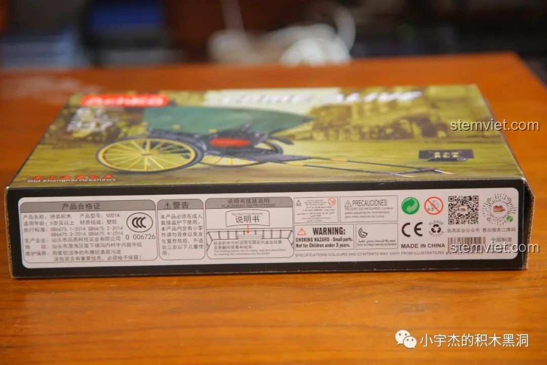 Thông tin nhà sản xuất và cảnh báo an toàn trên hộp bộ lắp ráp Xe người kéo cho con trai 6+.
