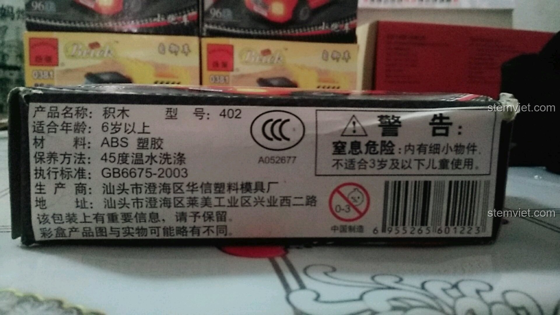 Phần thông tin sản phẩm và cảnh báo an toàn trên vỏ hộp đồ chơi lắp ráp Enlighten 402.