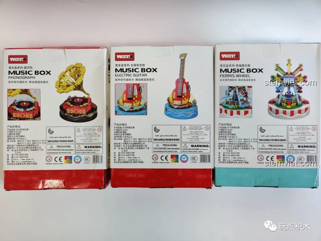 Mặt sau của ba hộp sản phẩm WOMA Music Box, hiển thị thông tin chi tiết và các chứng nhận an toàn cho trẻ em.