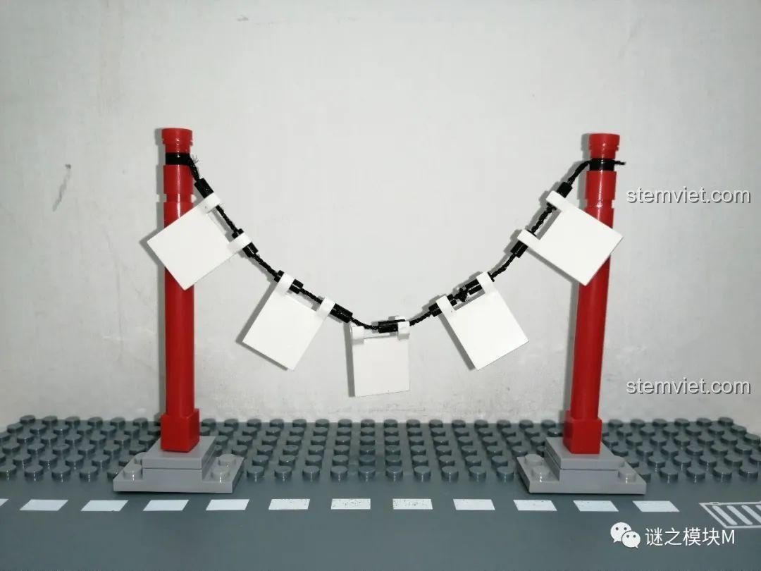 Tiểu cảnh dây phơi bùa giấy màu trắng trong bộ đồ chơi lắp ráp PRCK 69612.