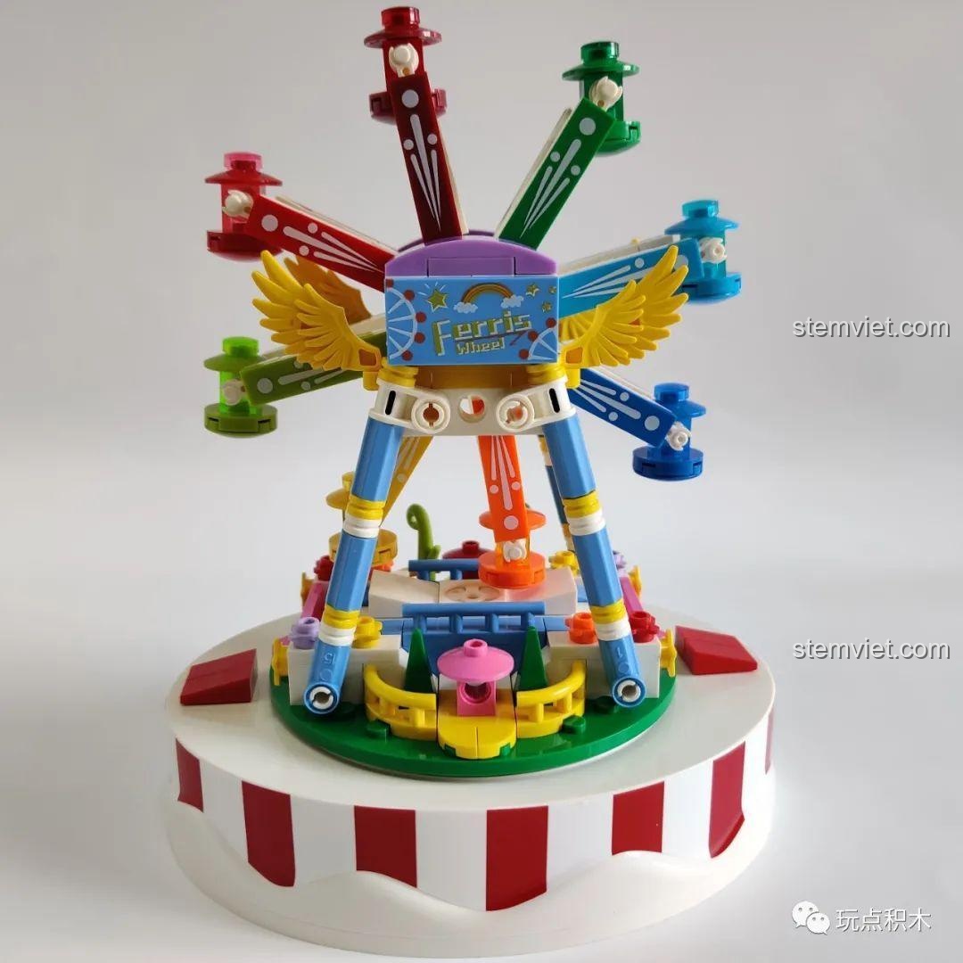 Toàn cảnh mô hình vòng quay hạnh phúc WOMA C0366 từ góc chính diện, khoe trọn vẻ đẹp rực rỡ, vui tươi.