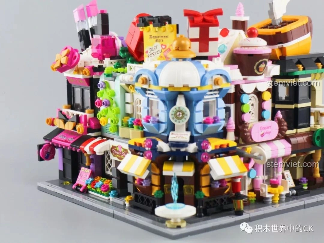 Góc nhìn tổng thể dãy phố đồ chơi lắp ráp Keepplay City Corner C0101-C0105 từ phía trước, thể hiện sự sống động.