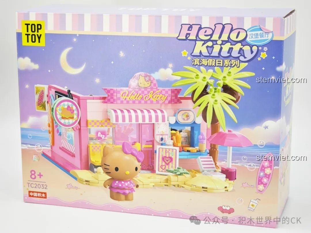 Mặt trước hộp bộ lắp ghép TOP TOY TC2032 Nhà hàng Hamburger Hello Kitty Bãi Biển, hiển thị mô hình và nhân vật.