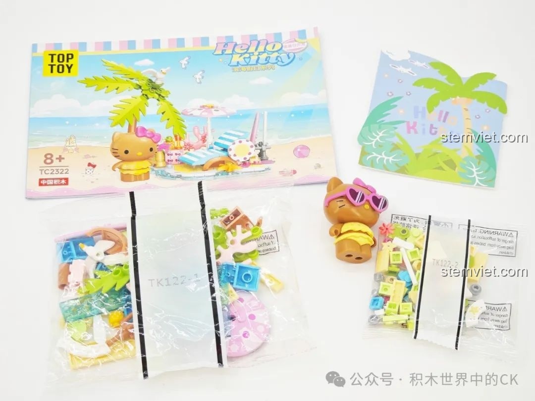 Nội dung bên trong hộp bộ lắp ráp TOP TOY TC2322 Mỹ Mỹ Nhật Quang, bao gồm sách hướng dẫn và mảnh ghép.