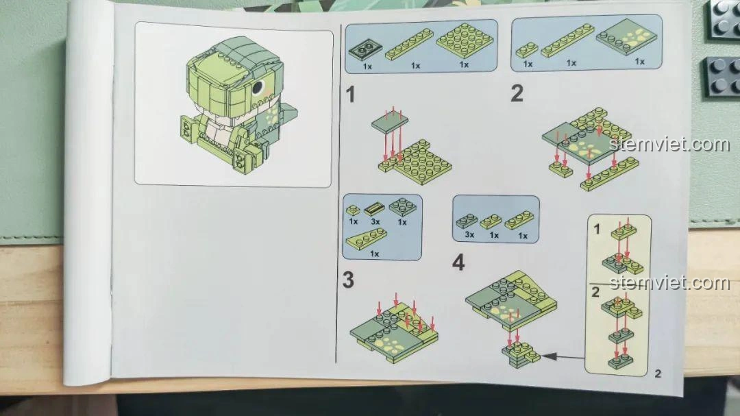 Trang đầu tiên của sách hướng dẫn lắp ráp bộ lắp ghép Khủng long Bạo Chúa Ăn Vặt JAKI JK5102, bắt đầu các bước.