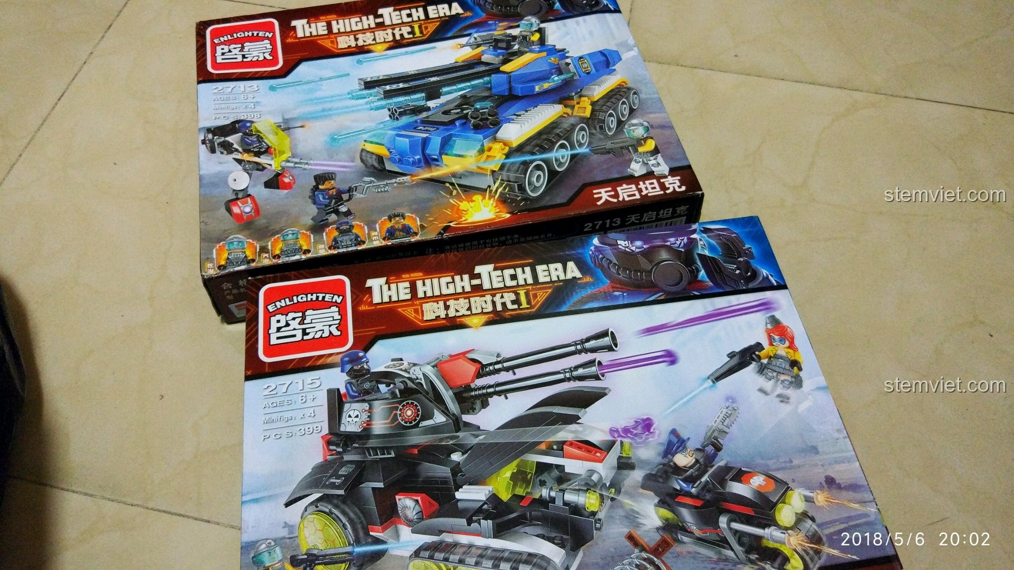 Toàn cảnh hai hộp đồ chơi QMAN 2713 Xe Tăng Khải Huyền và 2715 Pháo Laser với hình ảnh minh họa sống động.