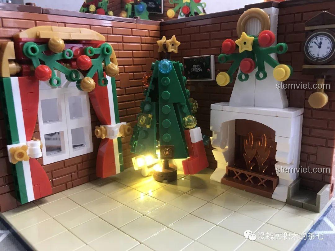 Hoàn thiện phần trang trí trên lò sưởi của bộ đồ chơi Wekki 506118, tạo điểm nhấn cho Phòng khách Giáng Sinh, bộ đồ chơi giá tốt.