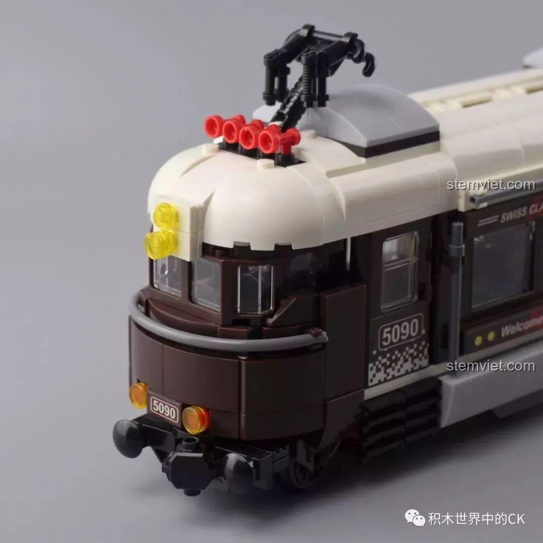 Cận cảnh phần đầu tàu Winner 5090 Tàu Hỏa Thành Phố Cổ Điển Thụy Sĩ, chi tiết mái và đèn.