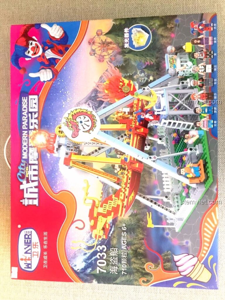 Hộp đồ chơi lắp ráp Winner 7033 Tàu Lượn Cướp Biển Công Viên Giải Trí với hình ảnh chú hề và tàu lượn đầy màu sắc.