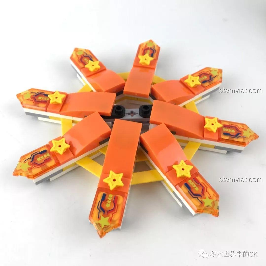 Trang trí các nan hoa màu cam cho phần trung tâm của bánh xe, tạo điểm nhấn rực rỡ.