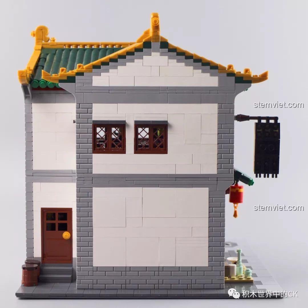 Nội thất chi tiết bên trong tầng 1 của bộ lắp ráp Trà Quán Hương茗, với bàn ghế và quầy kệ.