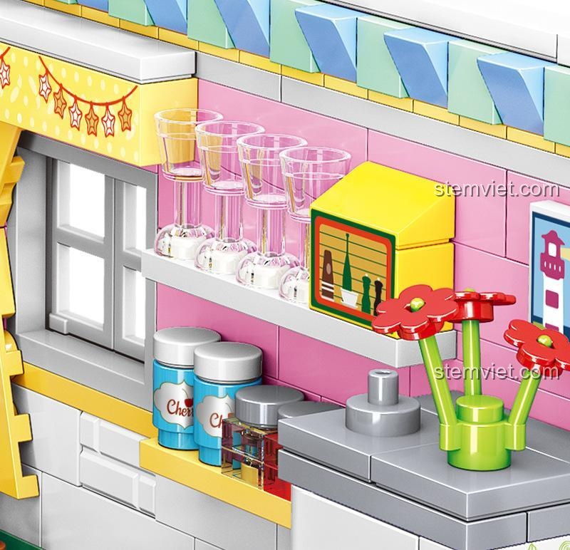 Hộp đầy đủ của bộ đồ chơi lắp ráp Góc Bếp Ấm Cúng Mini Zhe Gao 00870, hiển thị số mảnh 595 và độ tuổi 6+, đảm bảo chất lượng.