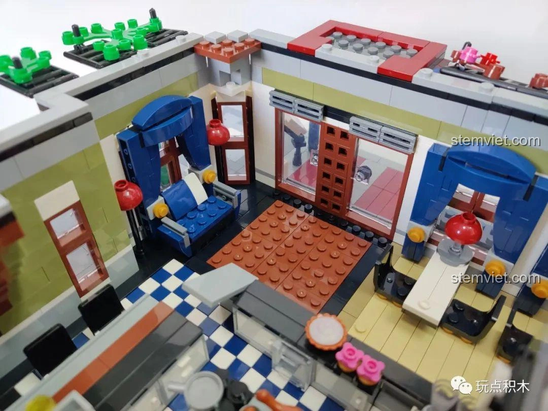 Khu vực ăn uống sang trọng bên trong mô hình ZHEGAO QL0920 Nhà Hàng Lãng Mạn, với bàn ghế và đèn.