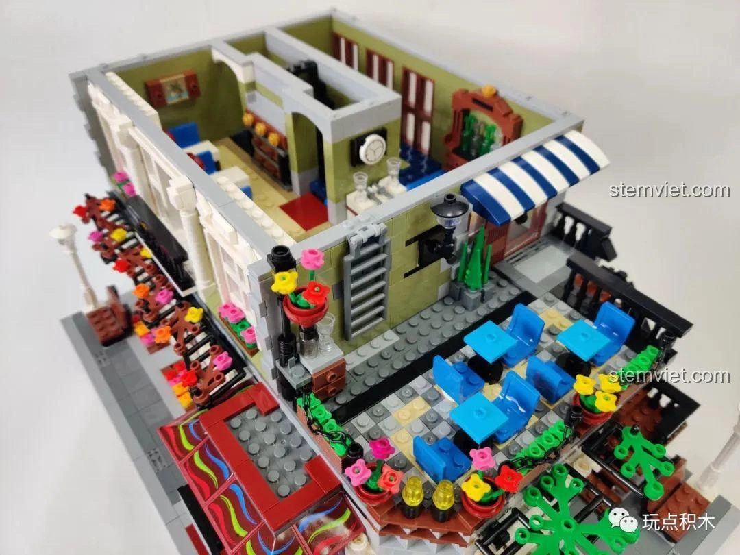 Khu vực bếp và quầy bar bên trong mô hình ZHEGAO QL0920 Nhà Hàng Lãng Mạn, kết nối liền mạch.