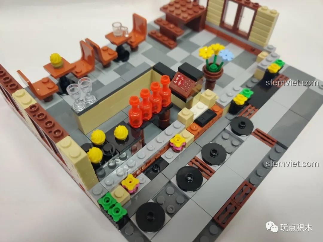 Cận cảnh quầy bar và khu vực bàn ăn trong nhà của mô hình Zhegao QL0937, thiết kế chi tiết.