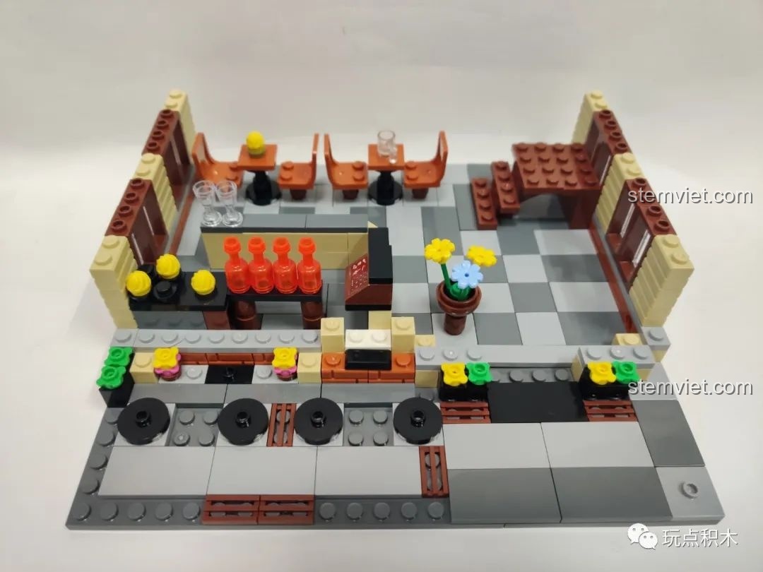 Hoàn thành bước 1 của bộ Zhegao QL0937, nội thất tầng 1 của nhà hàng với bàn ghế và quầy bar.