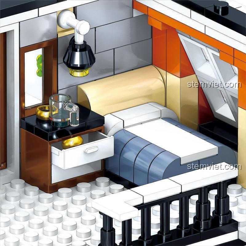 Phòng ngủ áp mái tiện nghi trên tầng 3 của Khách sạn Sân vườn QL0940, có giường, tủ đầu giường và đèn ngủ.