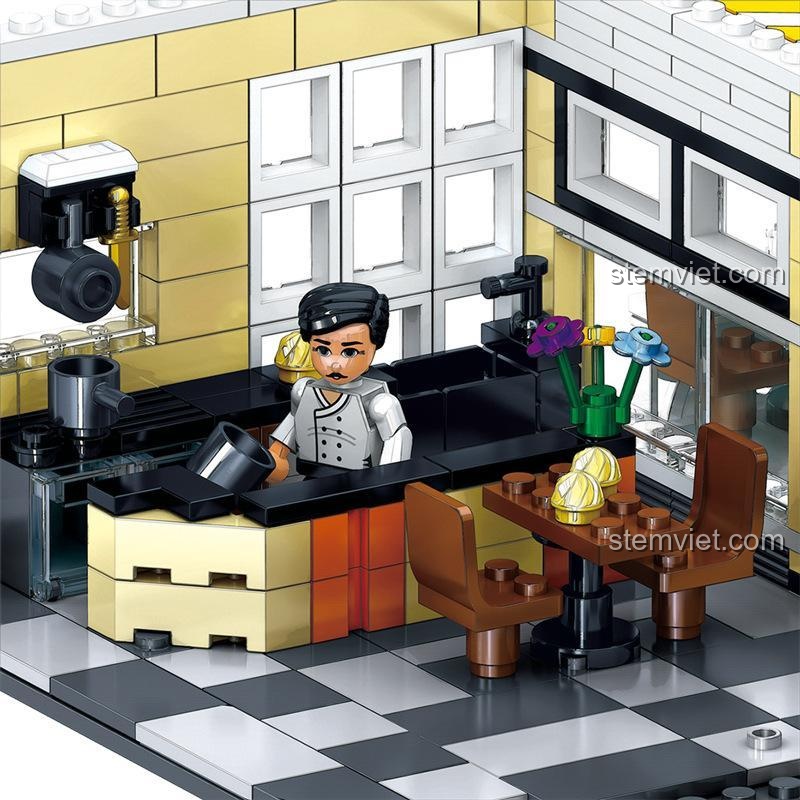 Không gian quán cafe ở tầng 1 của bộ đồ chơi Tòa nhà phố cổ điển, có máy pha cafe, bàn ghế và sàn caro.