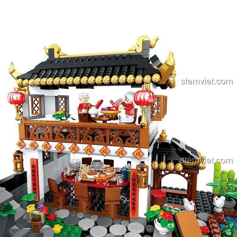 Cảnh gia đình sum vầy ăn Tết trong bộ lắp ghép Đại Gia Đình Đoàn Viên Đón Tết ZHEGAO QL0957, chi tiết sống động, phù hợp cho bé trai và bé gái 6 tuổi.