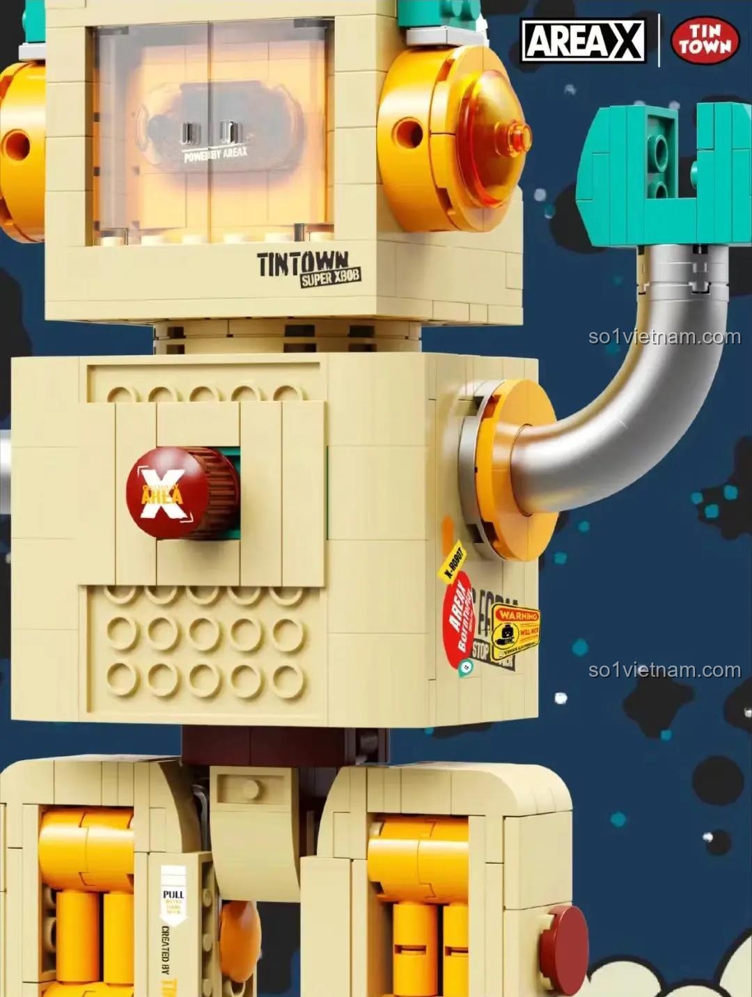 Ảnh cận cảnh chi tiết thân của bộ lắp ghép Robot Nông Trại Xăng Dầu, nổi bật núm xoay và các sticker trang trí.