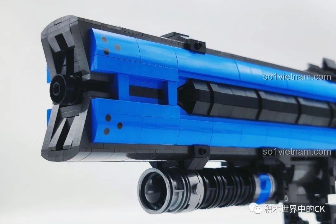Cận cảnh chi tiết đầu nòng súng của mô hình JIESTAR 58023, với các mảnh ghép màu xanh và đen được tạo hình tinh xảo.