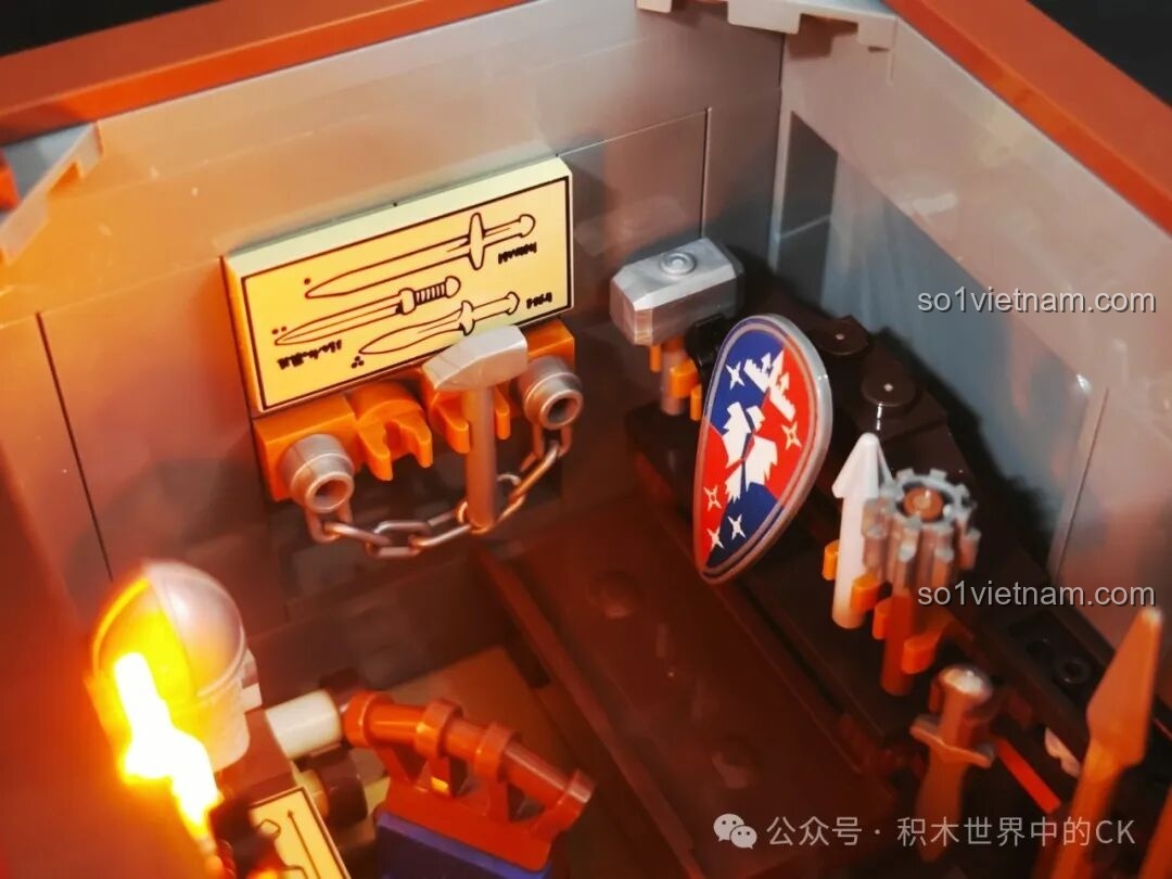 Cận cảnh giá treo vũ khí trong xưởng rèn Funwhole F9040, với các loại kiếm, búa và khiên được trưng bày.