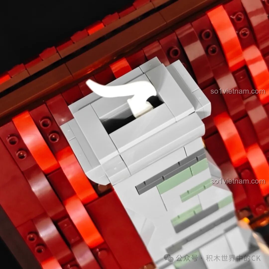 Chi tiết đỉnh ống khói của mô hình Funwhole F9040, với một mảnh ghép hình làn khói trắng đang bay lên.